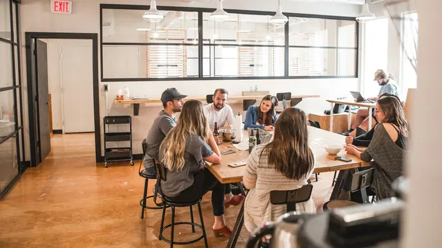 talking people sitting beside table Collaborative Meeting